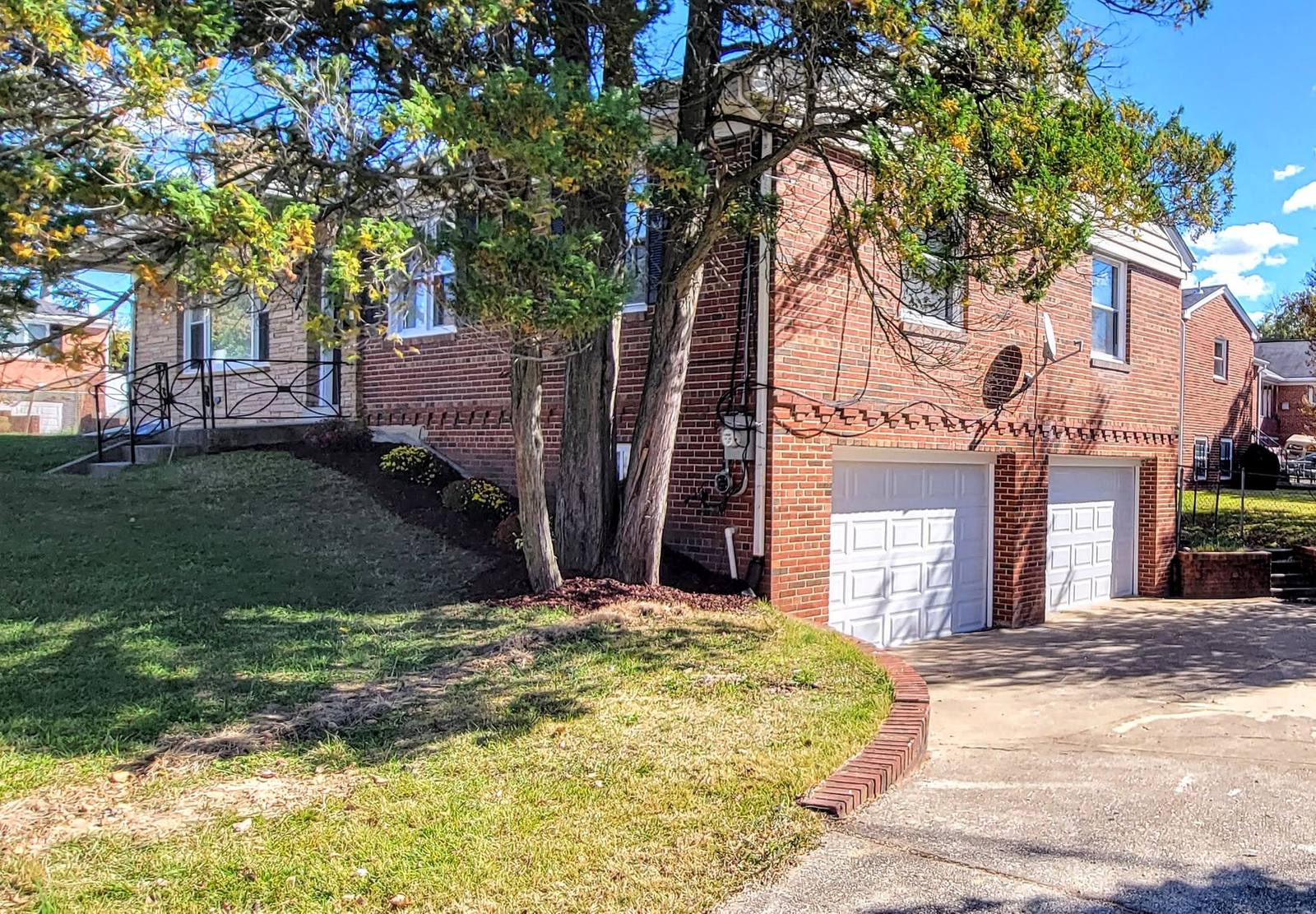 Brick single-family home exterior after renovation, Temple Hills, MD